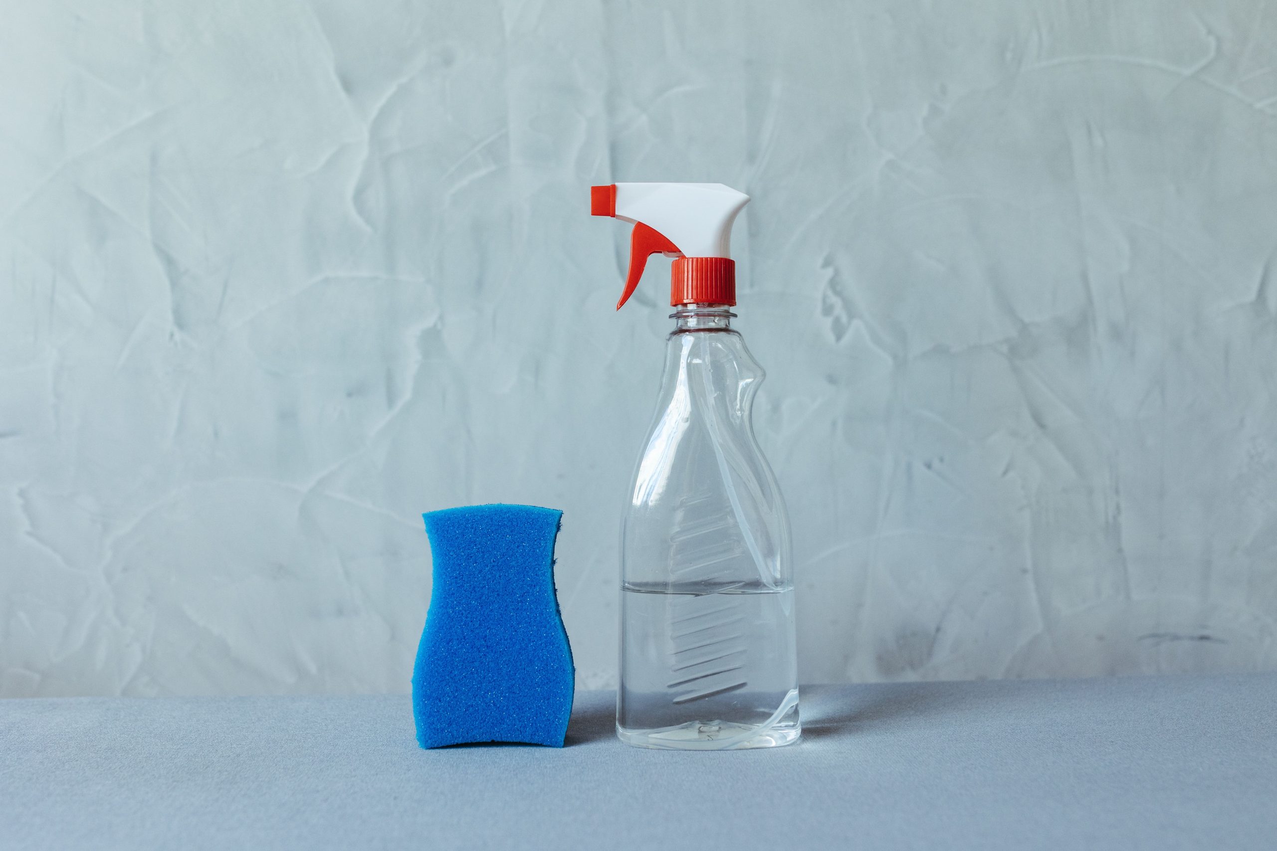 Minimal cleaning spray bottle and sponge